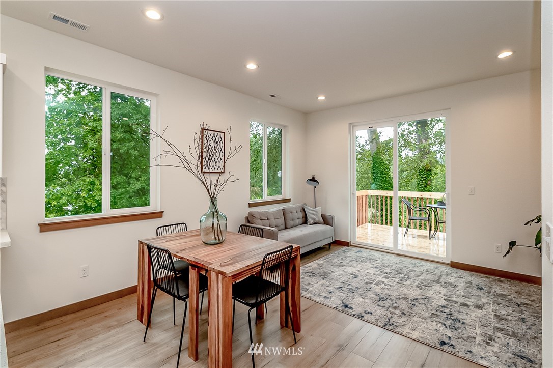2624 Callow Road, Unit A Lake Stevens, WA 98258 - Photo 12 of 22 a view of a dining room with furniture window and wooden floor