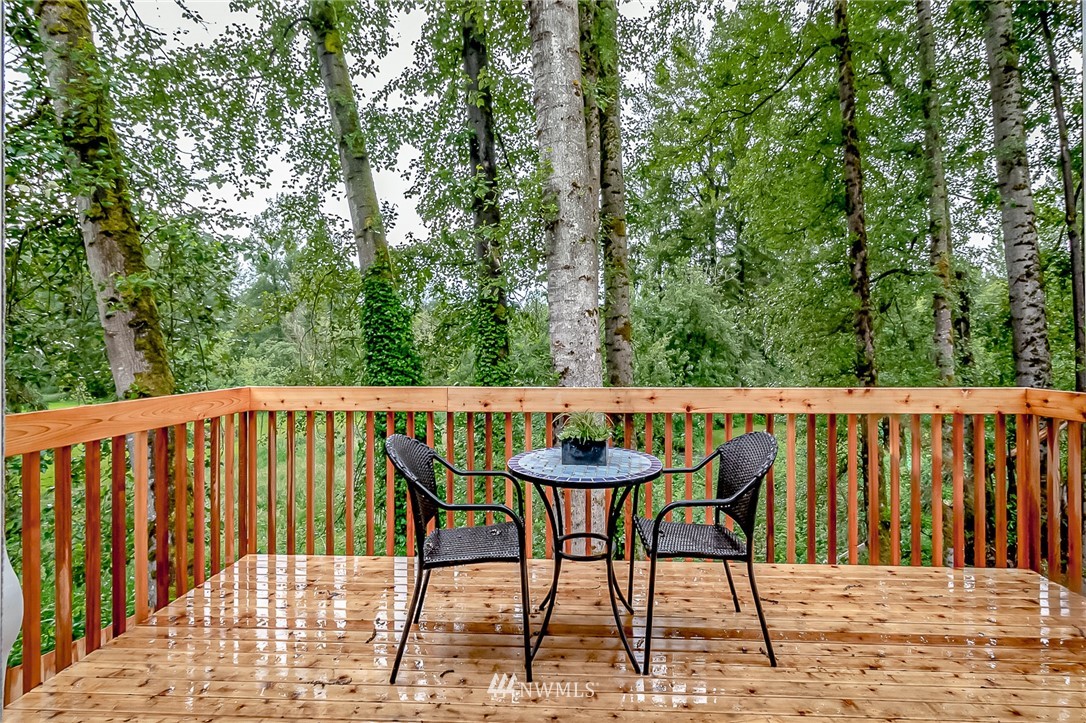 2624 Callow Road, Unit A Lake Stevens, WA 98258 - Photo 14 of 22 a deck of a house with table and chairs