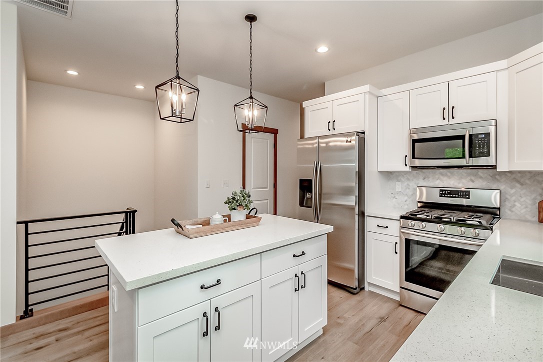 2624 Callow Road, Unit A Lake Stevens, WA 98258 - Photo 15 of 22 a kitchen with a sink stainless steel appliances and wooden floor