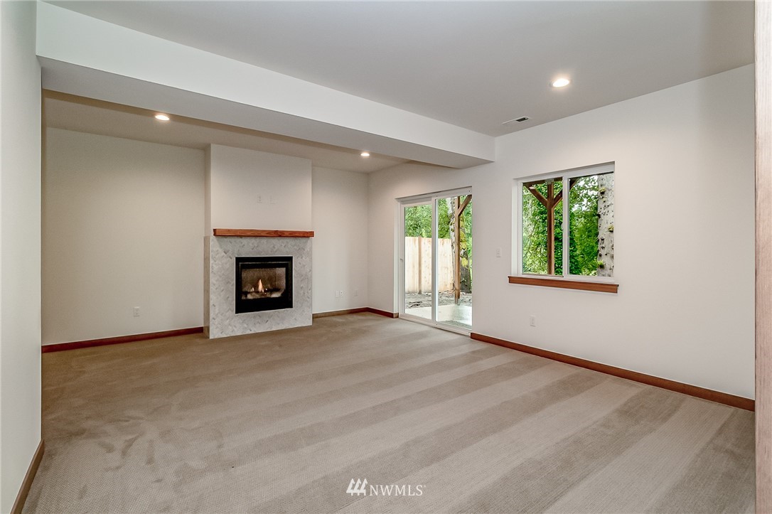 2624 Callow Road, Unit A Lake Stevens, WA 98258 - Photo 18 of 22 an empty room with windows and fireplace