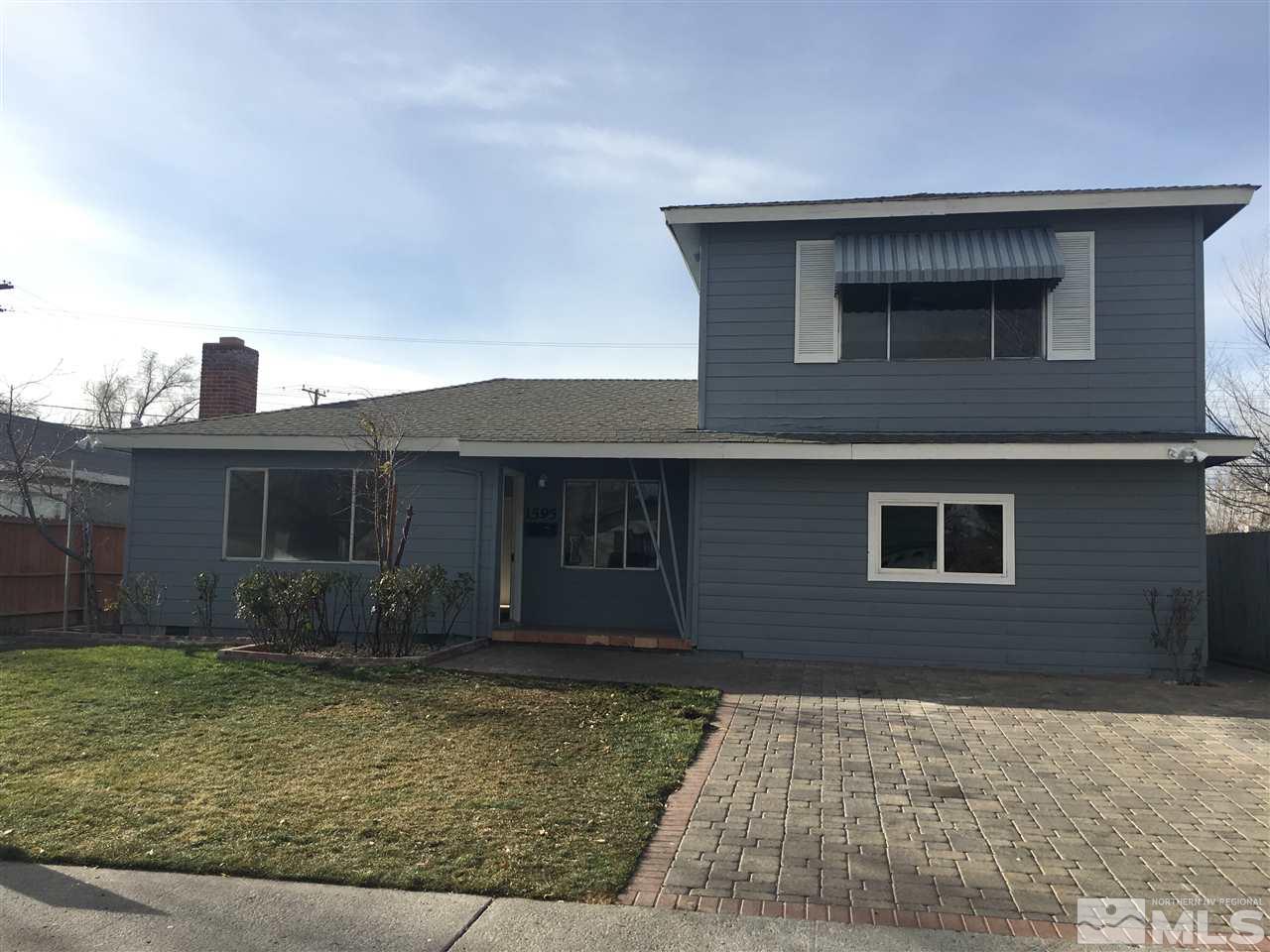1595 Auburn Way Reno, NV 89502 - Photo 1 of 1 a front view of a house with garden