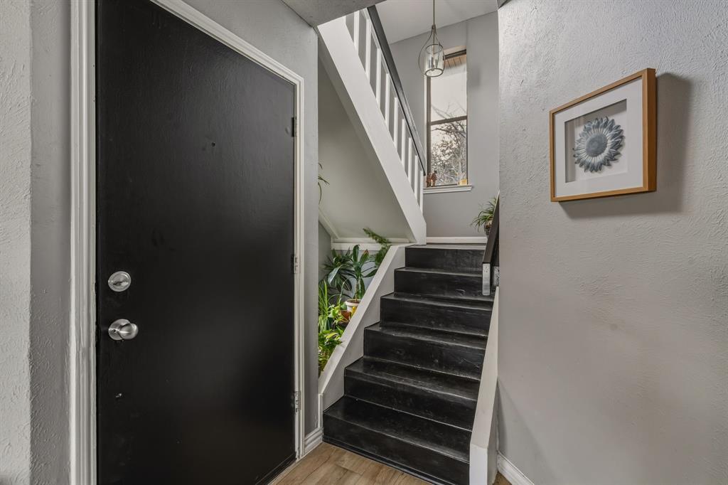 705 Via Miramonte Mesquite, TX 75150 - Photo 13 of 28 a view of staircase with wooden floor and white walls