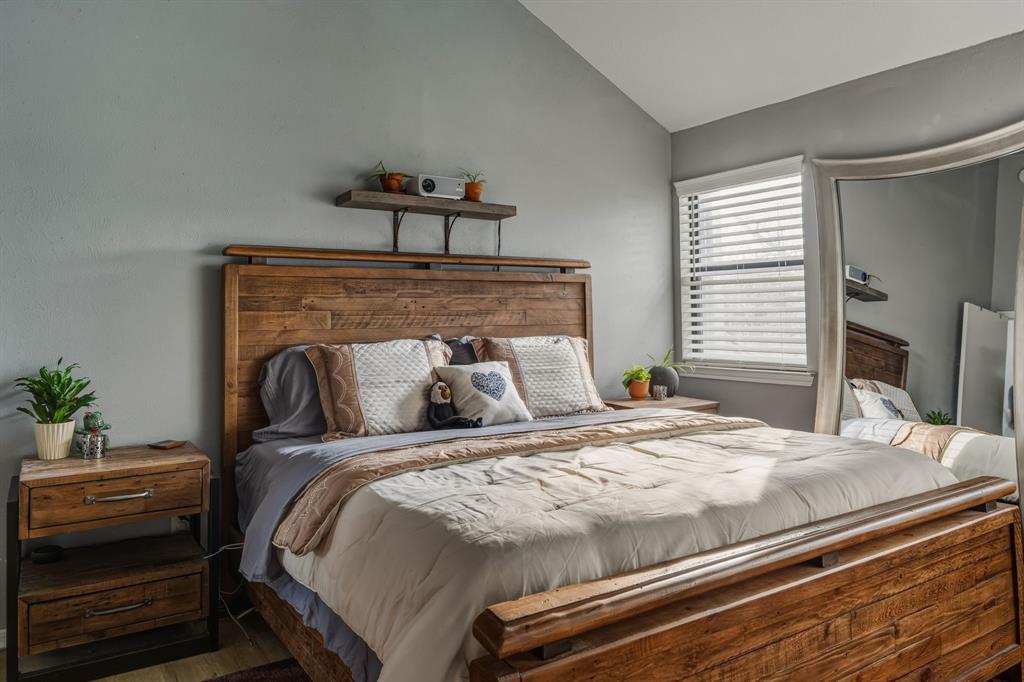 705 Via Miramonte Mesquite, TX 75150 - Photo 27 of 28 a bed sitting in a bedroom and table