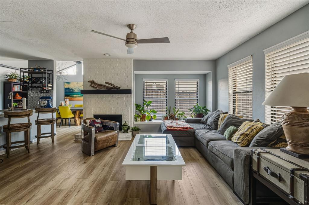 705 Via Miramonte Mesquite, TX 75150 - Photo 3 of 28 a living room with furniture and a wooden floor