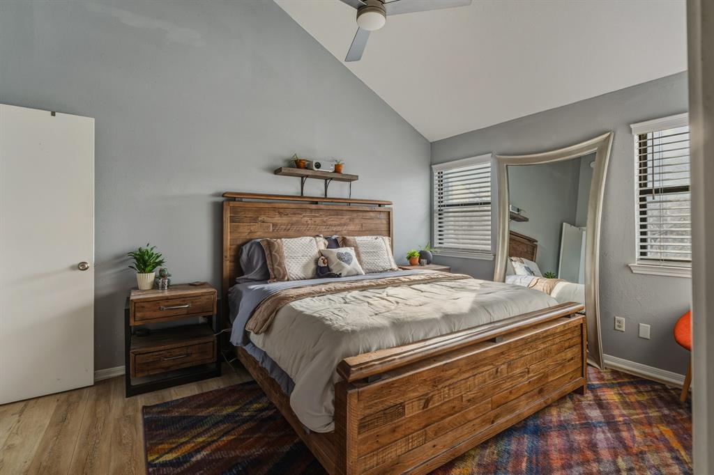 705 Via Miramonte Mesquite, TX 75150 - Photo 5 of 28 a bed sitting in a bedroom next to a window with a dresser