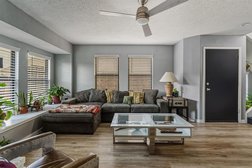 705 Via Miramonte Mesquite, TX 75150 - Photo 7 of 28 a living room with furniture wooden floor and a table