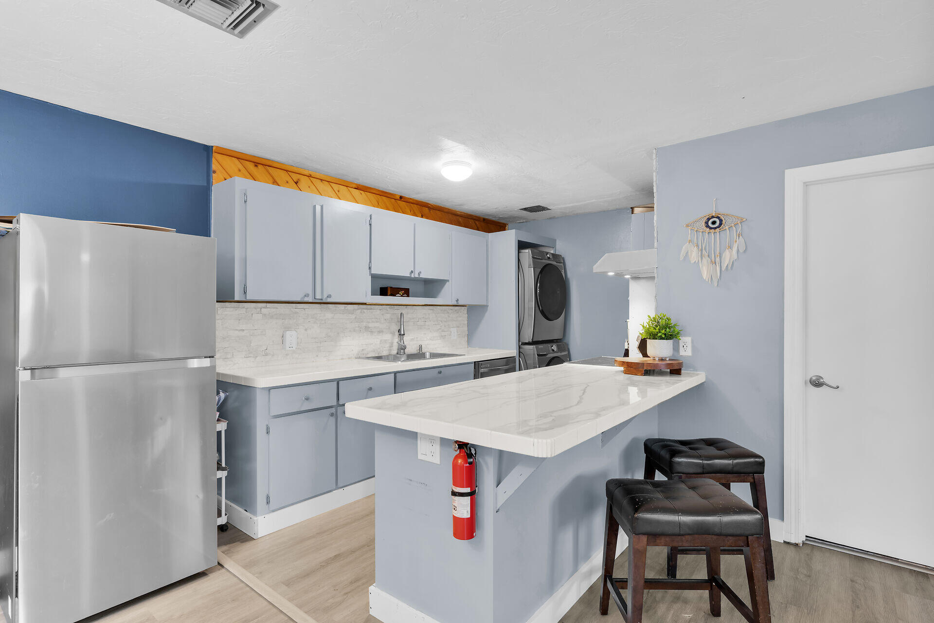 111 Stirrup Key Woods Road, Unit 2B1 Marathon, FL 33050 - Photo 12 of 36 a kitchen with a sink refrigerator and microwave