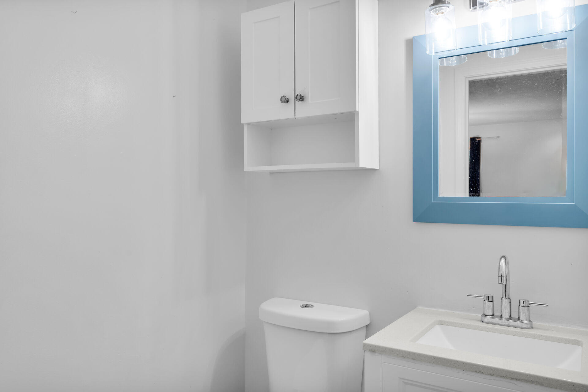 111 Stirrup Key Woods Road, Unit 2B1 Marathon, FL 33050 - Photo 17 of 36 a bathroom with a sink a toilet and mirror