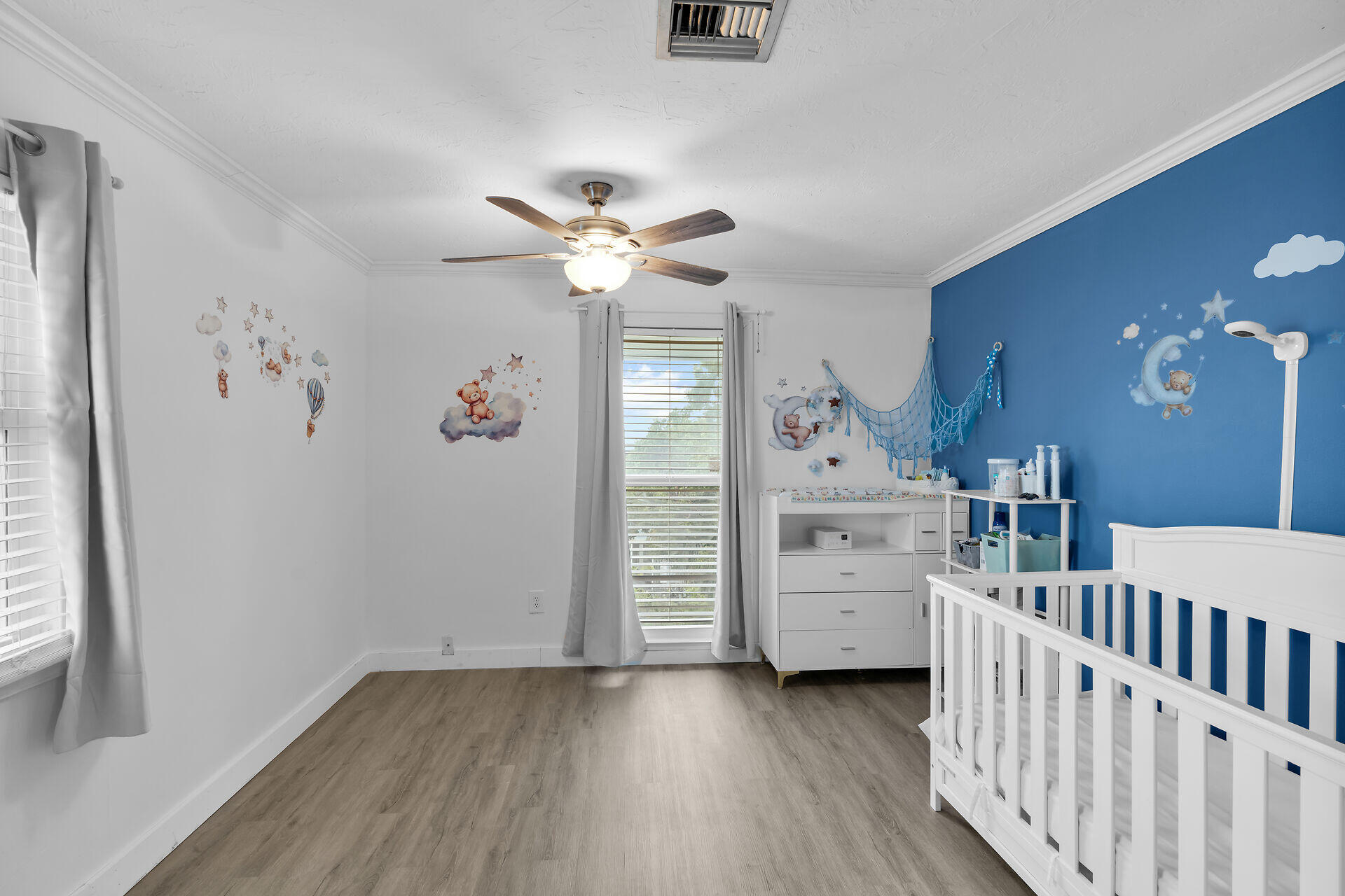 111 Stirrup Key Woods Road, Unit 2B1 Marathon, FL 33050 - Photo 26 of 36 wooden floor with chandelier fan and windows