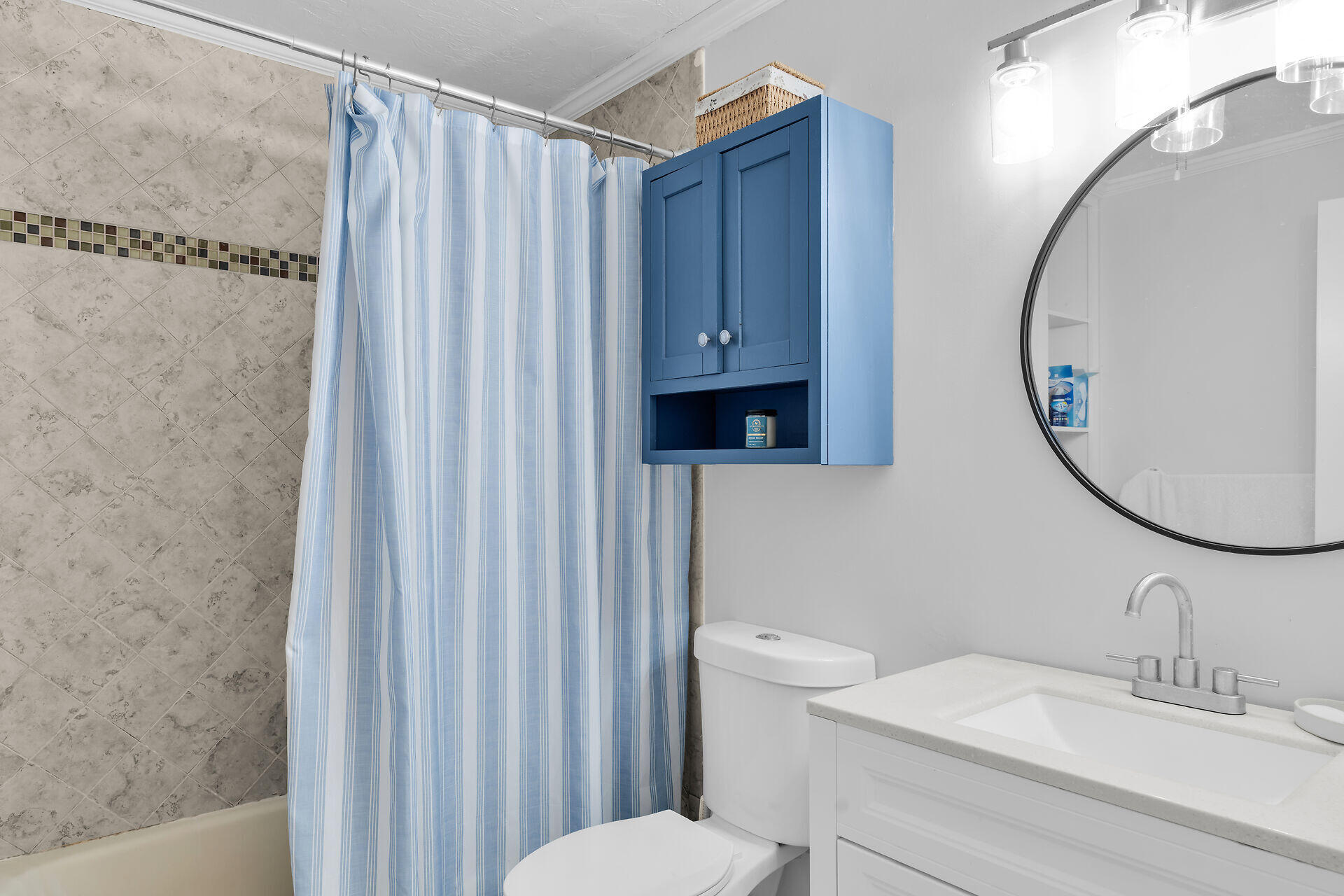 111 Stirrup Key Woods Road, Unit 2B1 Marathon, FL 33050 - Photo 28 of 36 a bathroom with a sink a toilet and a mirror