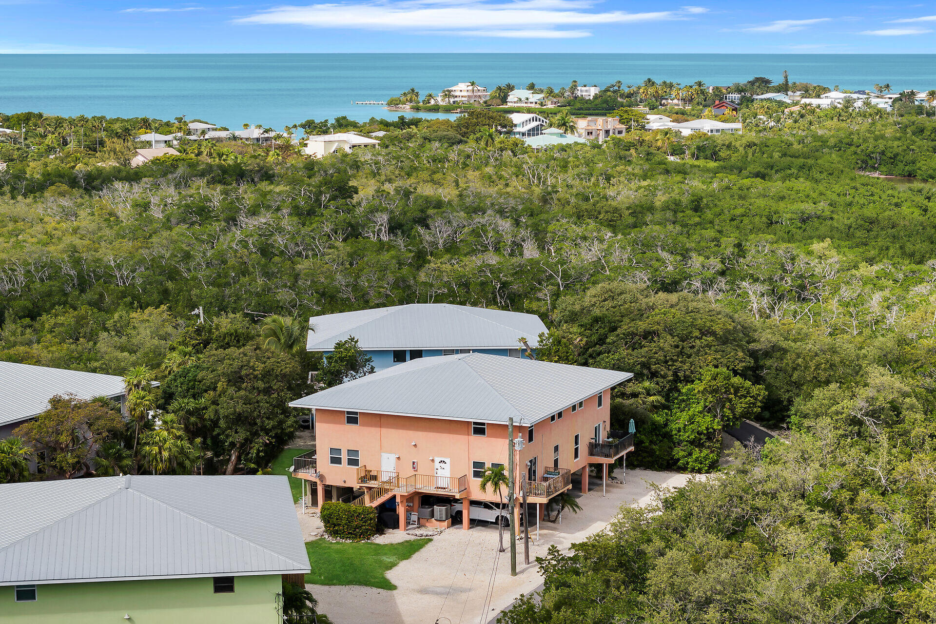 111 Stirrup Key Woods Road, Unit 2B1 Marathon, FL 33050 - Photo 32 of 36 an aerial view of a house with a yard swimming pool and outdoor seating