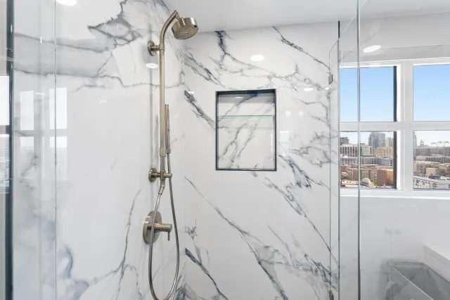 a bathroom with a bathtub and shower