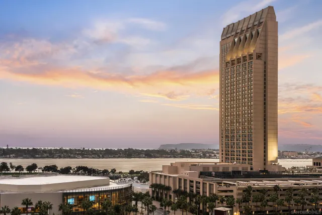 a view of a lake with a city skyline in the background
