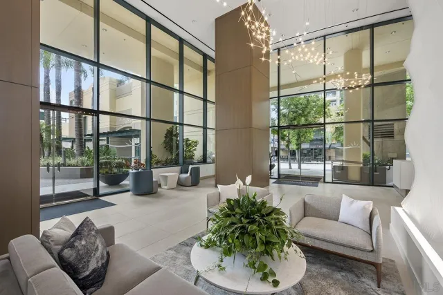 a view of a building with cars parked