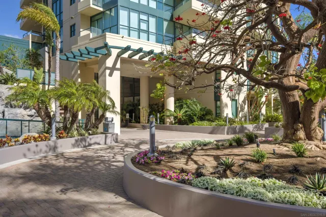 a view of swimming pool with outdoor seating and a potted plant