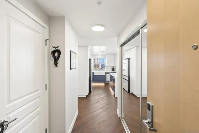 a view of a living room with a refrigerator