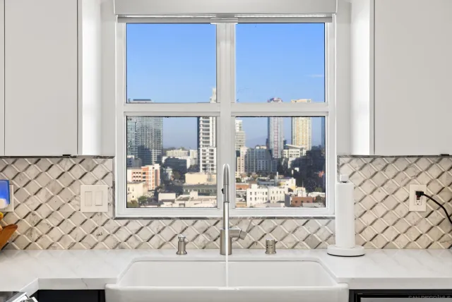 a view of a living room with a large window and table