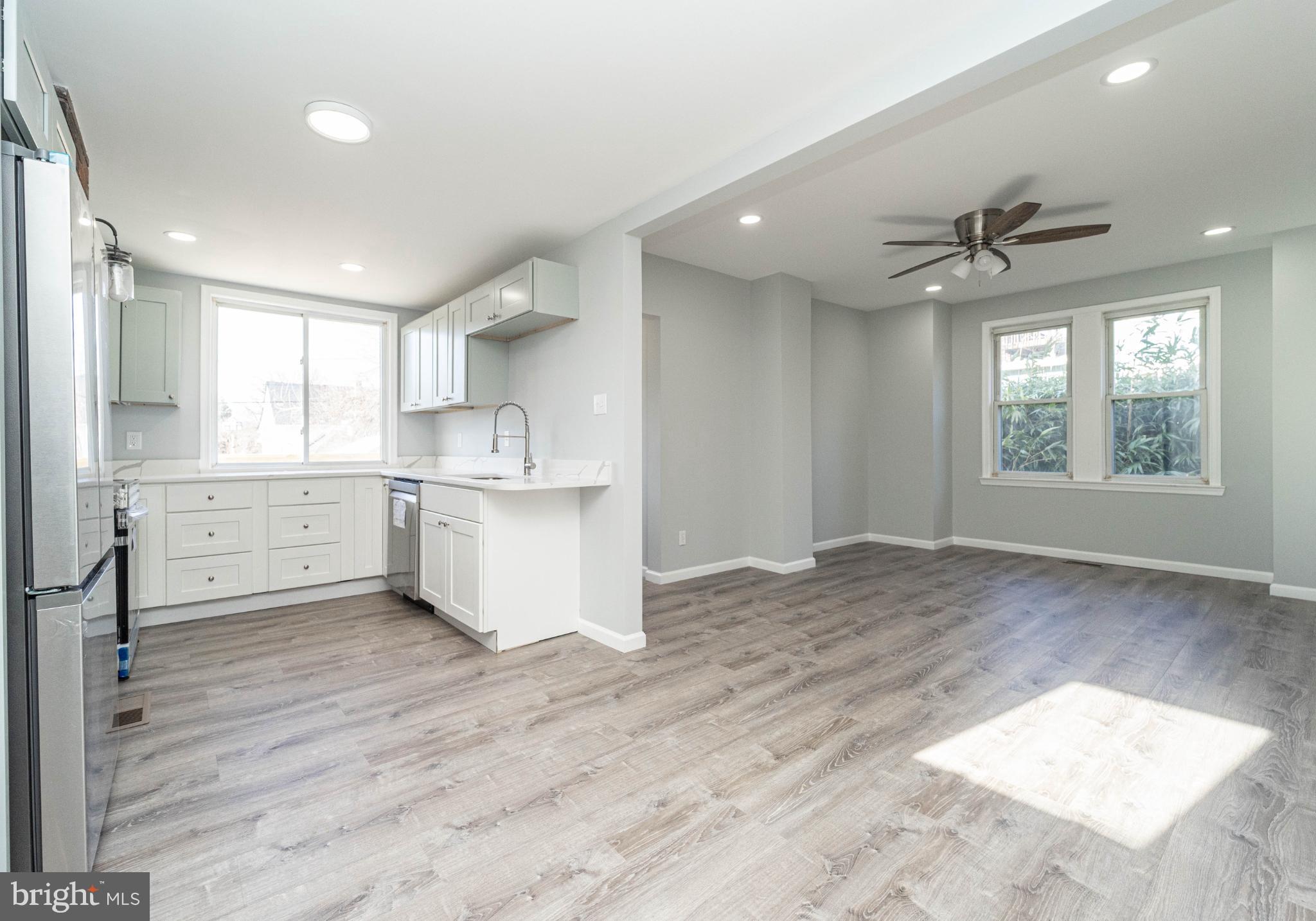 5312 Catalpha Road Baltimore, MD 21214 - Photo 14 of 41 a view of a kitchen with a sink and windows