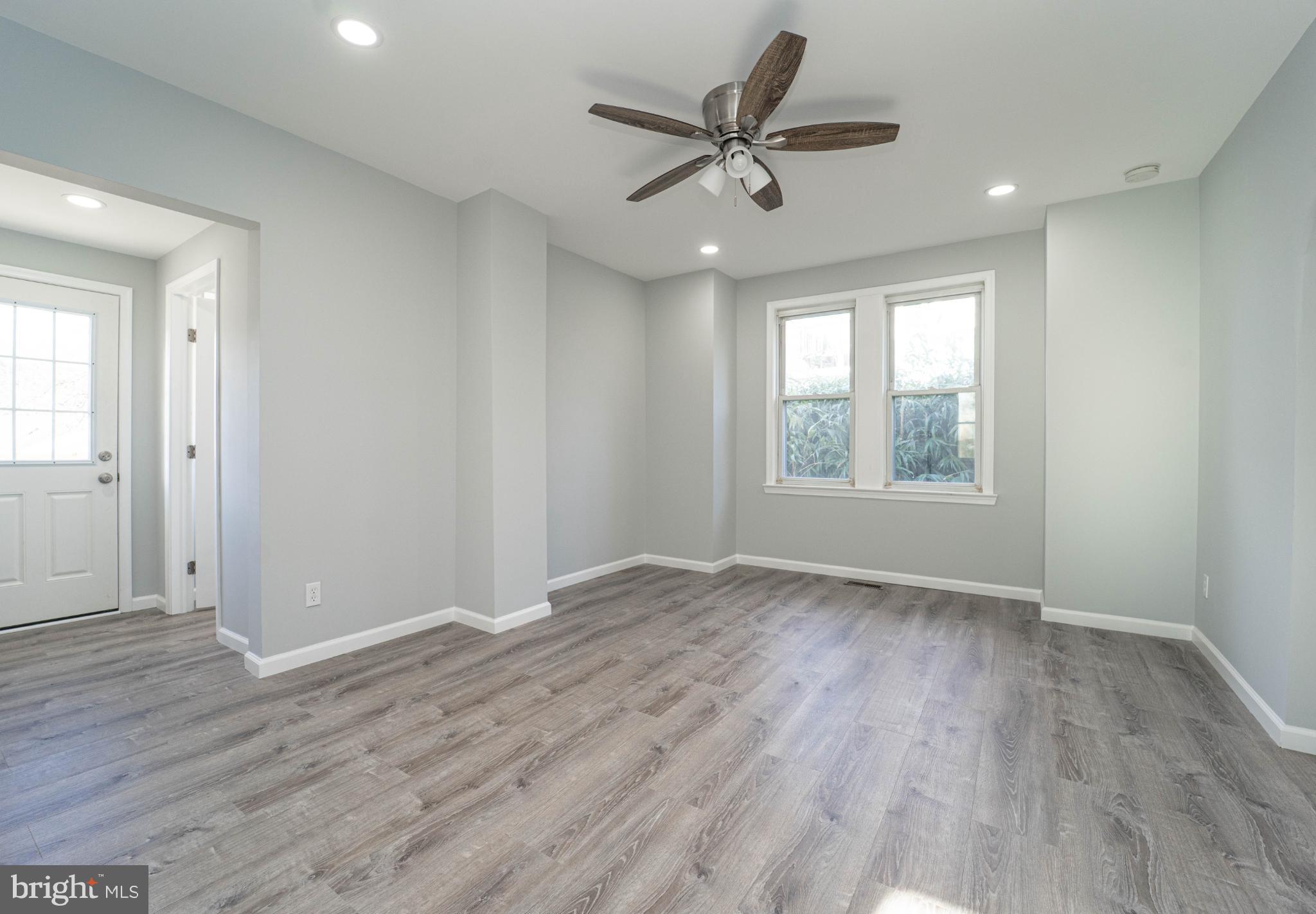 5312 Catalpha Road Baltimore, MD 21214 - Photo 19 of 41 wooden floor in an empty room with a window