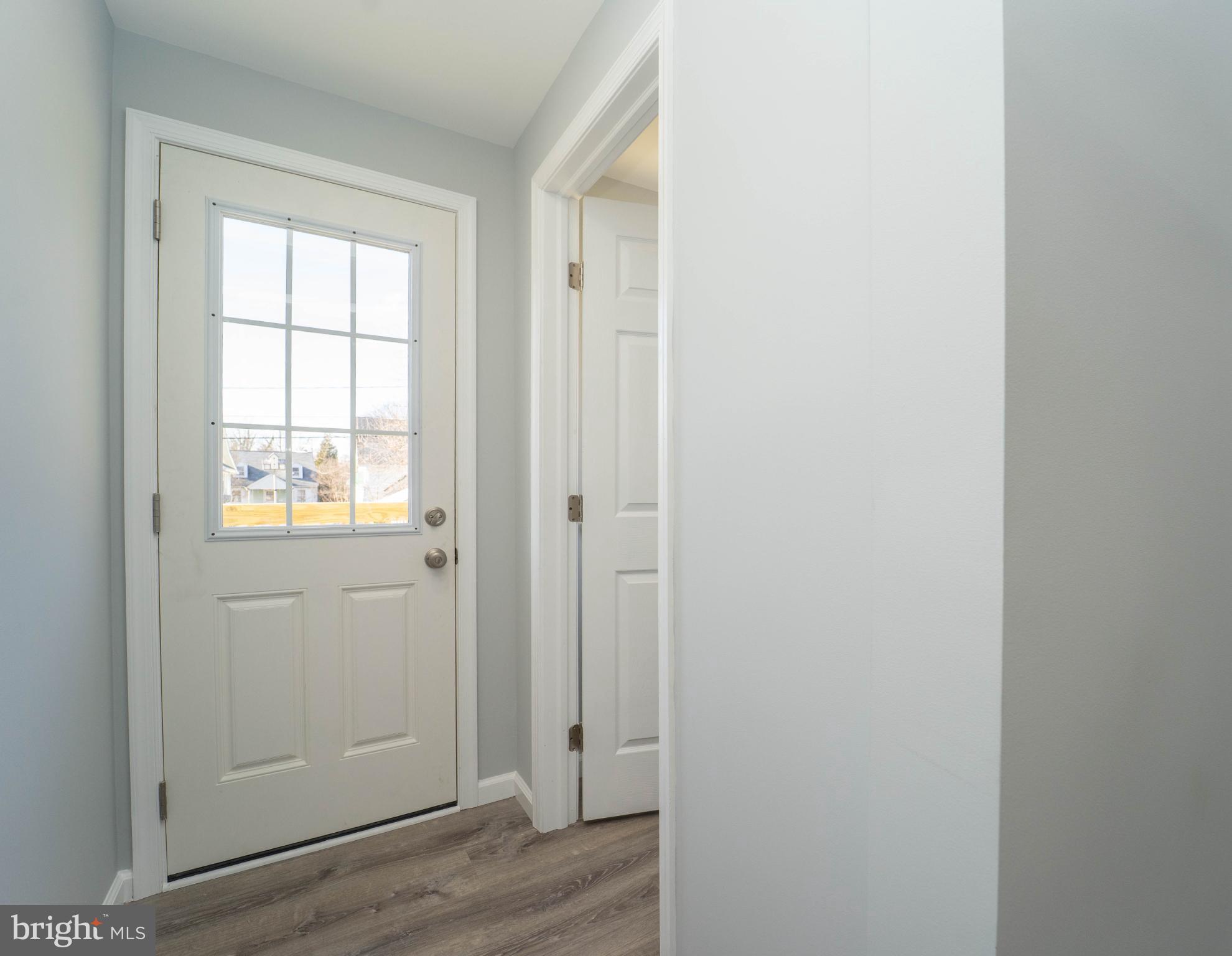 5312 Catalpha Road Baltimore, MD 21214 - Photo 22 of 41 a view of an entryway with wooden floor