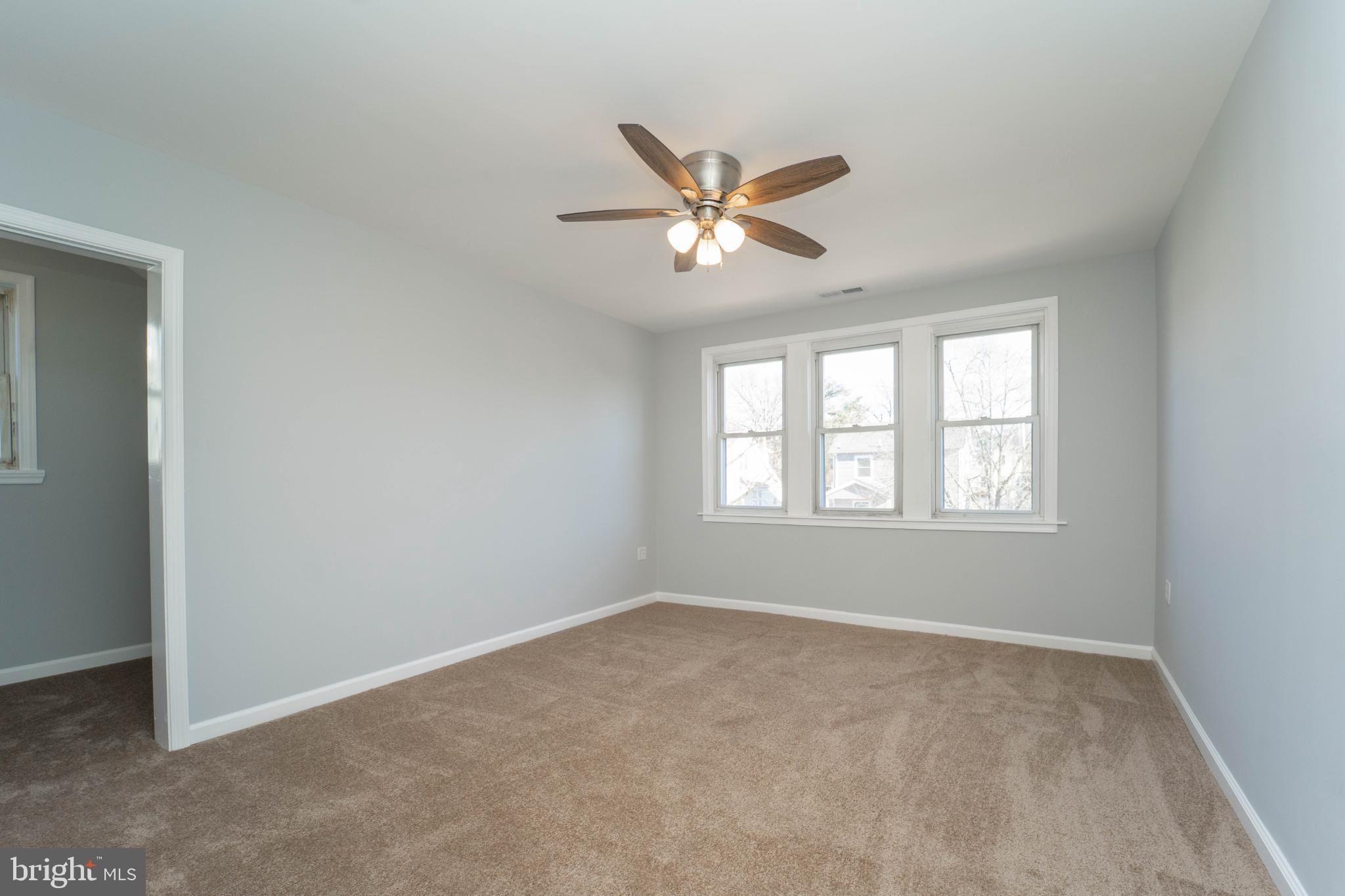 5312 Catalpha Road Baltimore, MD 21214 - Photo 31 of 41 a view of room with a ceiling fan and window