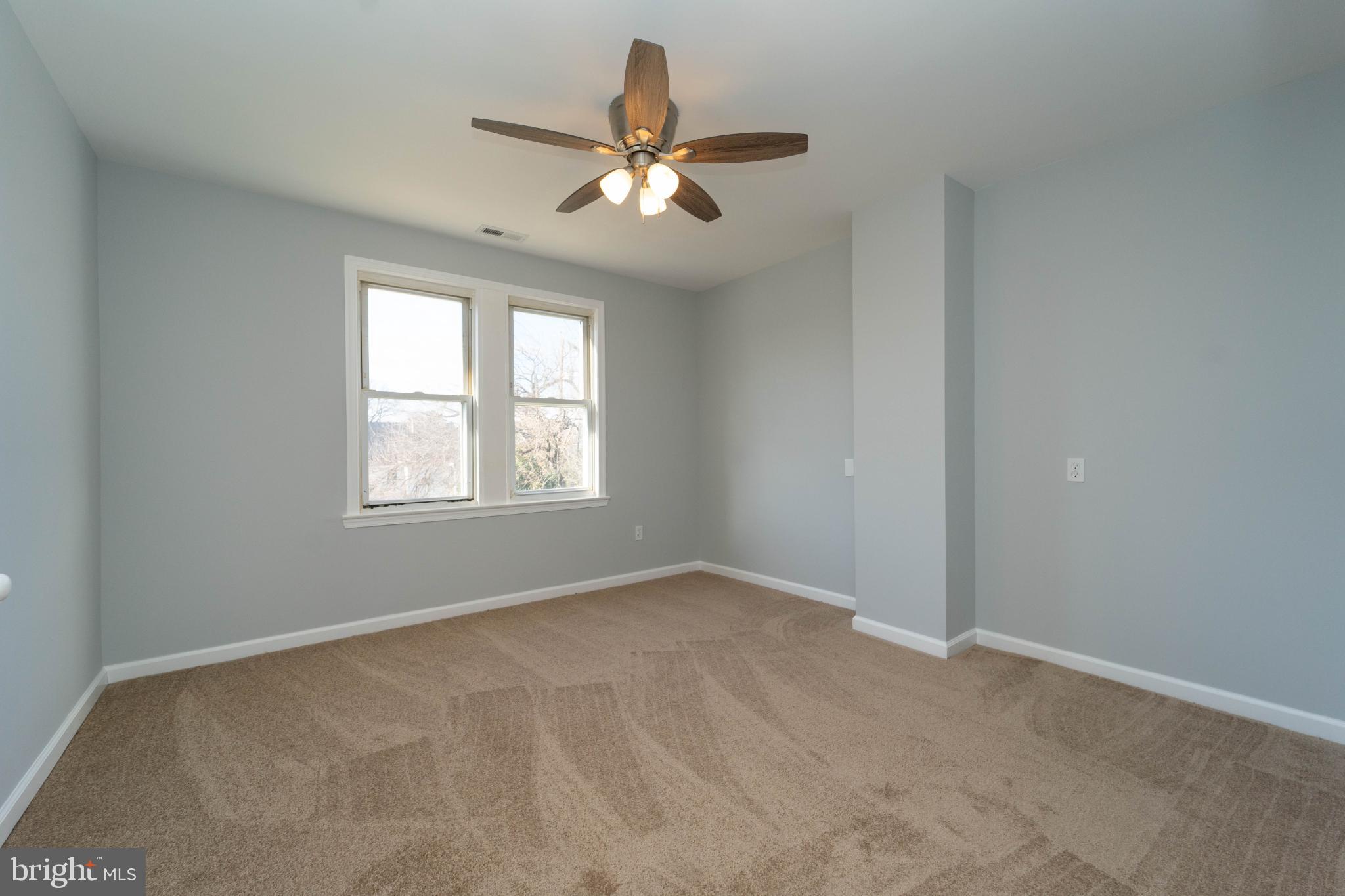 5312 Catalpha Road Baltimore, MD 21214 - Photo 40 of 41 a view of an empty room with a window