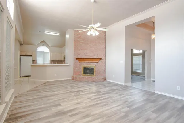 a view of a kitchen with a sink and a fireplace