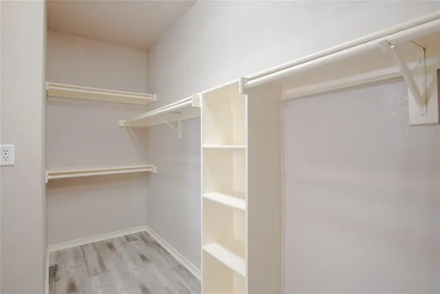 a view of an empty walk in closet