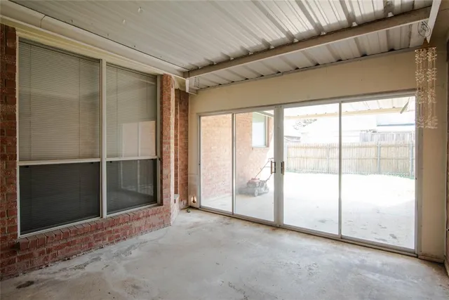 a view of empty room with sliding glass door