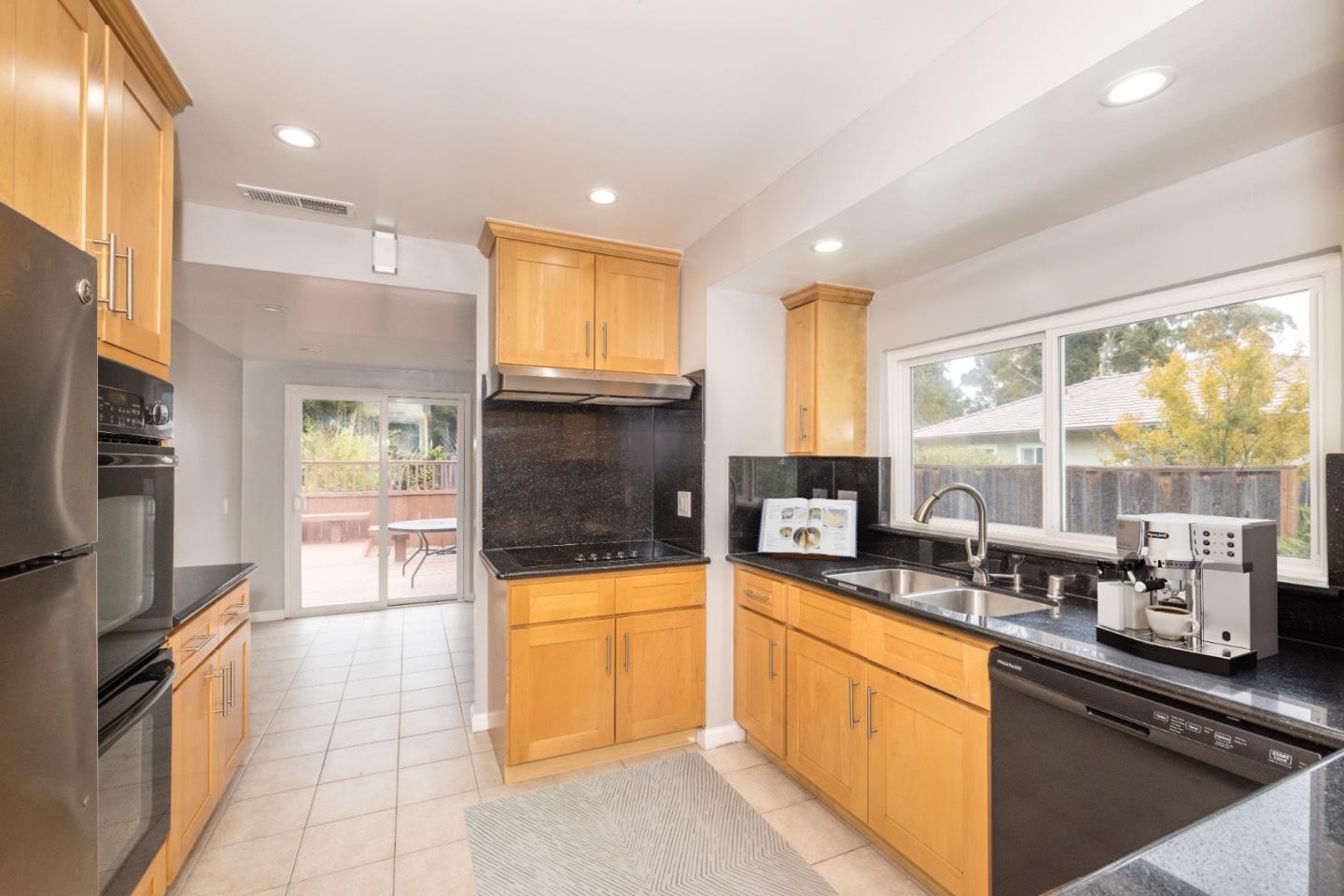 930 Sequoia Avenue Millbrae, CA 94030 - Photo 2 of 10 a kitchen with stainless steel appliances a sink a stove and a refrigerator