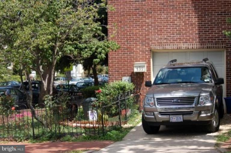 539 3rd Street Northeast Washington, DC 20002 - Photo 2 of 29 a front view of a house with car parked