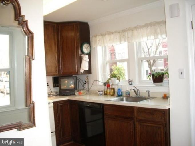539 3rd Street Northeast Washington, DC 20002 - Photo 20 of 29 a kitchen with sink a window and cabinets