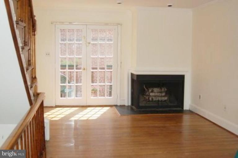 539 3rd Street Northeast Washington, DC 20002 - Photo 6 of 29 a view of an empty room with wooden floor and a window