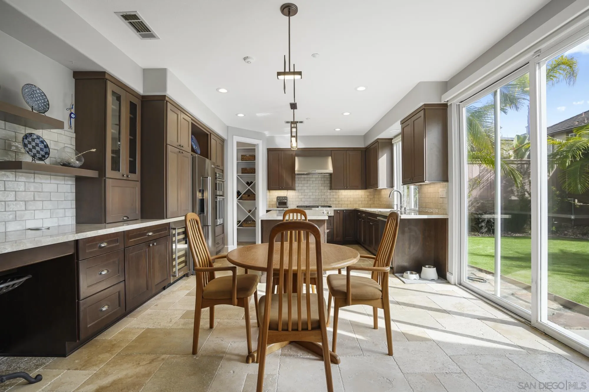 684 Cypress Hills Drive Encinitas, CA 92024 - Photo 12 of 43 a view of a dining room with furniture window and outside view