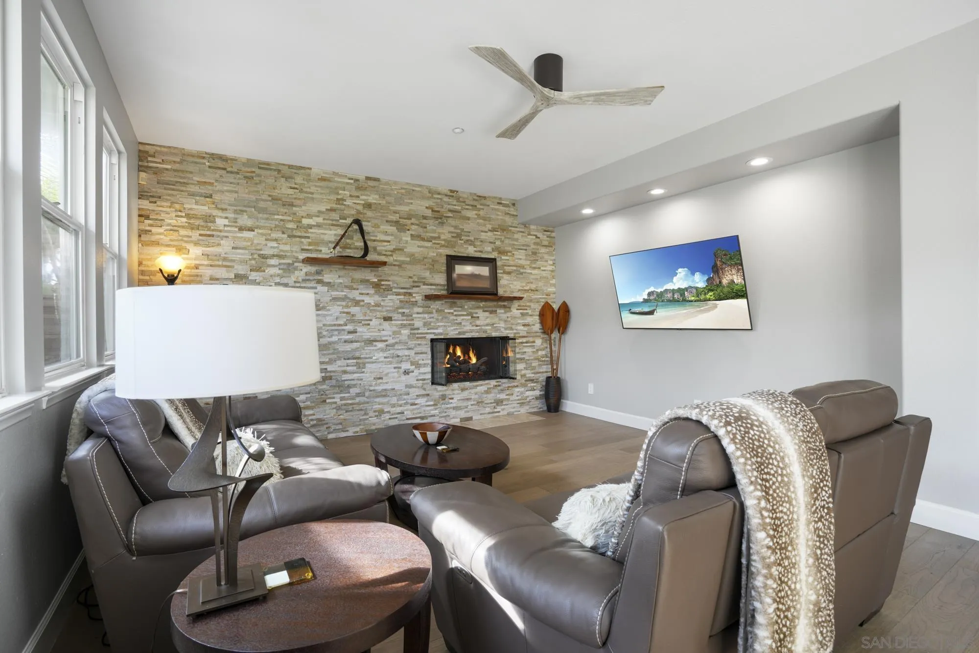 684 Cypress Hills Drive Encinitas, CA 92024 - Photo 13 of 43 a living room with furniture fireplace and a flat screen tv