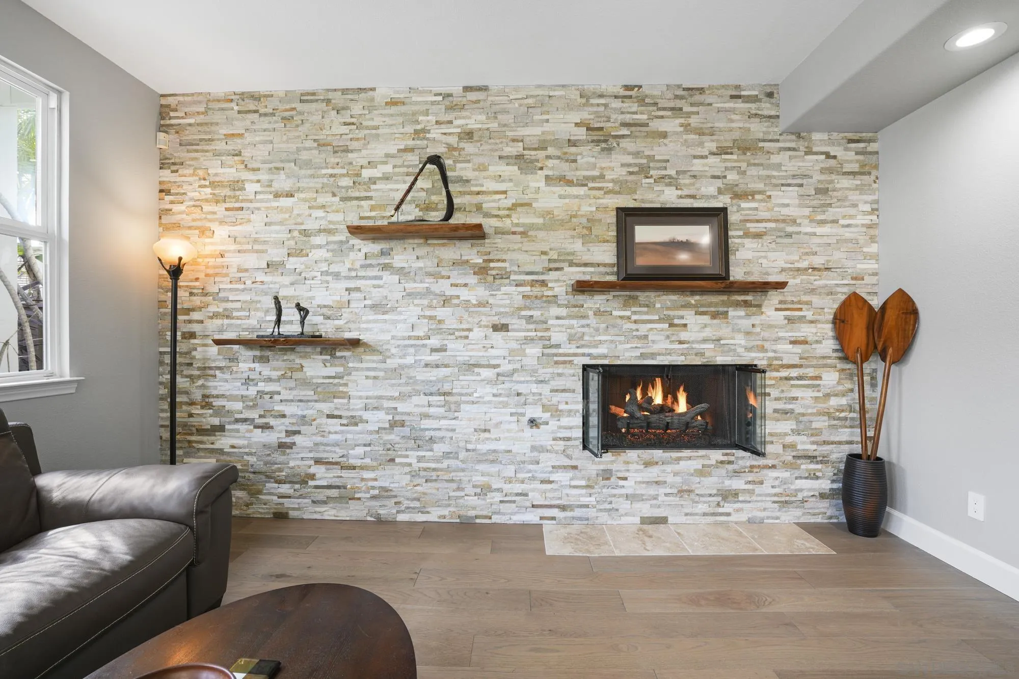 684 Cypress Hills Drive Encinitas, CA 92024 - Photo 14 of 43 a living room with furniture and a fireplace