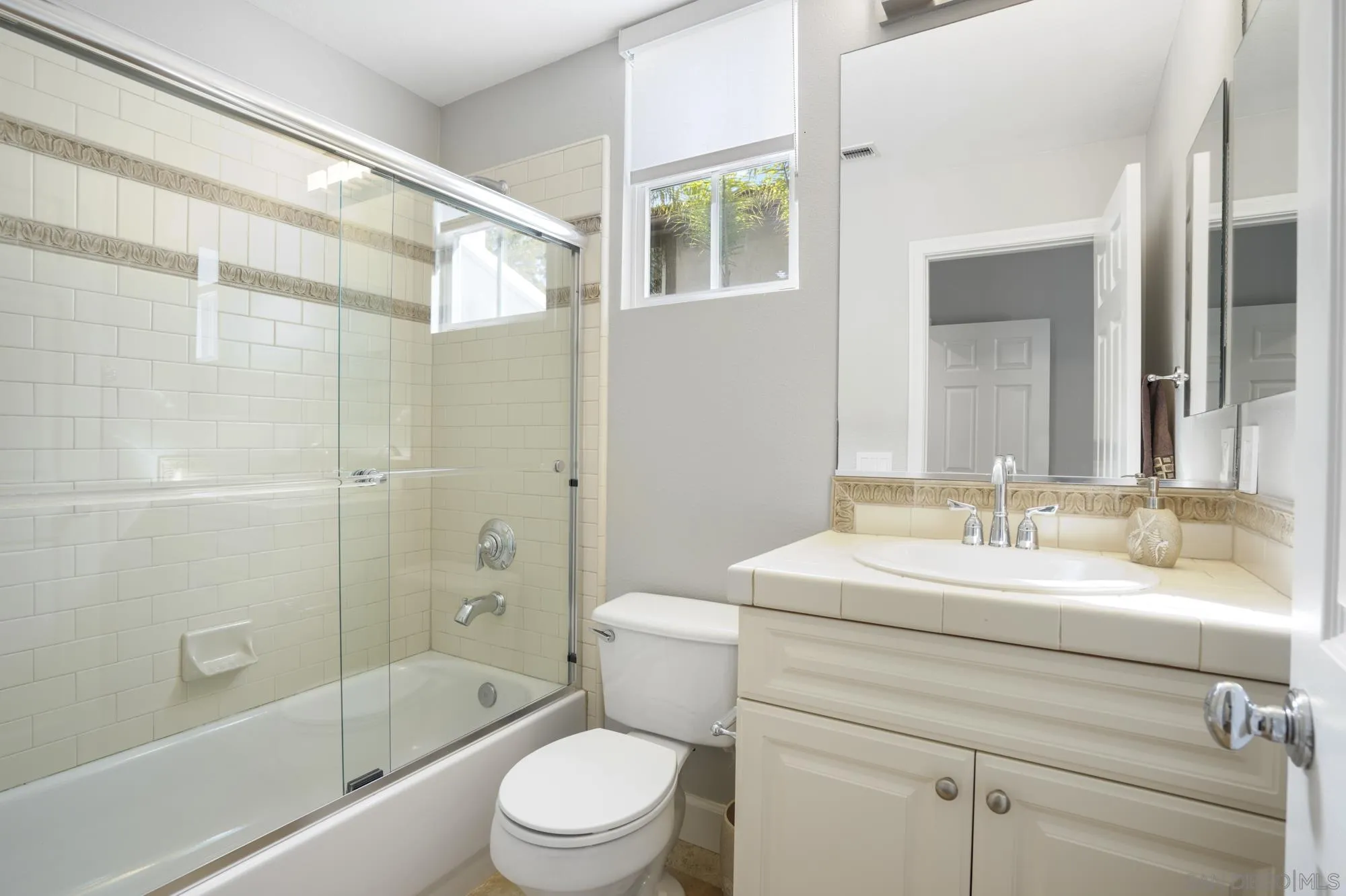 684 Cypress Hills Drive Encinitas, CA 92024 - Photo 18 of 43 a bathroom with a sink a toilet and shower