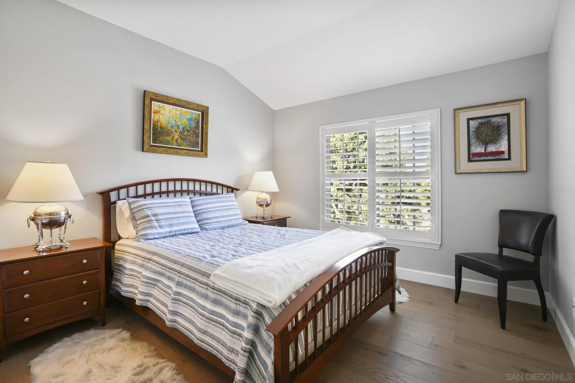 684 Cypress Hills Drive Encinitas, CA 92024 - Photo 20 of 43 a bedroom with a bed a chair and a window