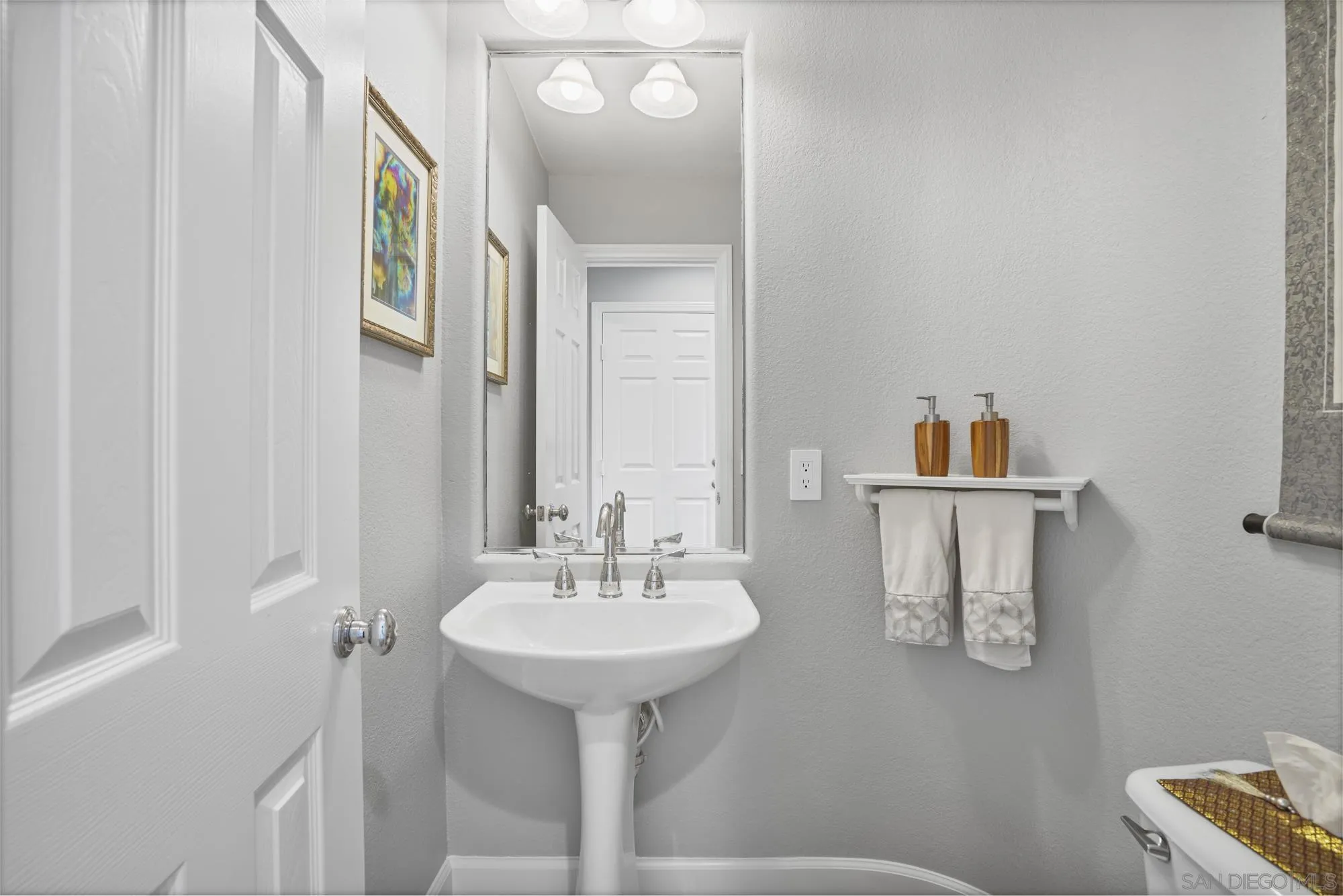 684 Cypress Hills Drive Encinitas, CA 92024 - Photo 21 of 43 a bathroom with a sink and a mirror