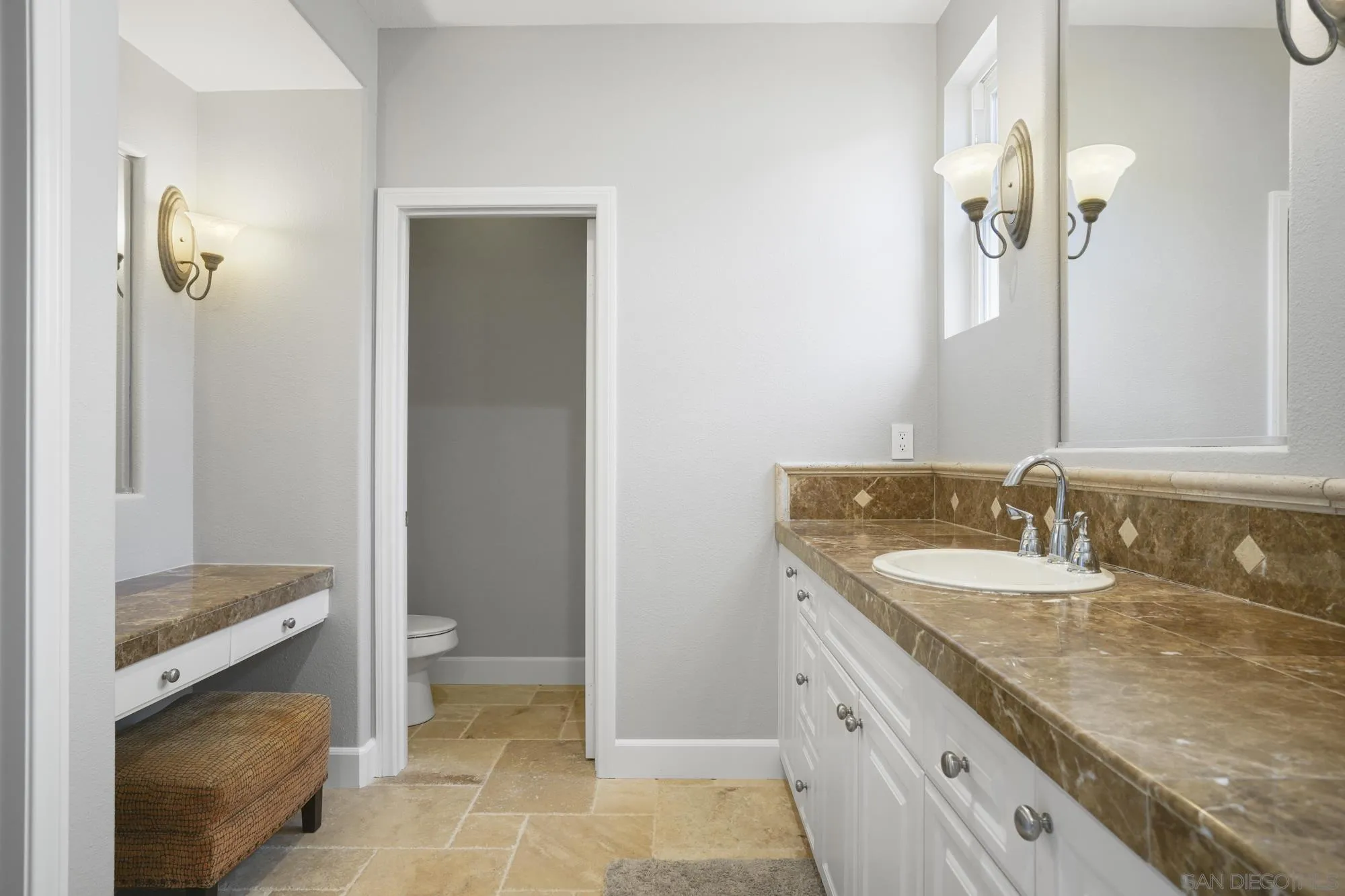 684 Cypress Hills Drive Encinitas, CA 92024 - Photo 26 of 43 a bathroom with a granite countertop sink and a mirror