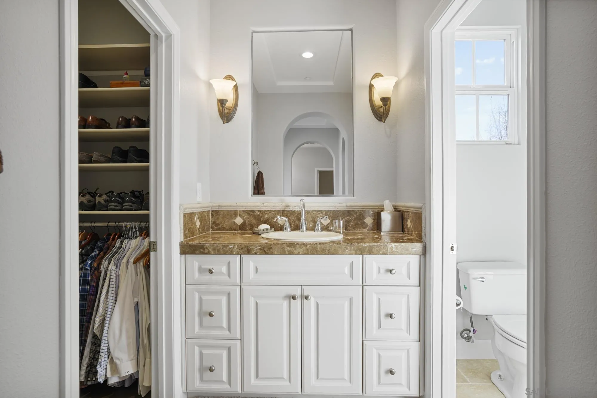 684 Cypress Hills Drive Encinitas, CA 92024 - Photo 27 of 43 a bathroom with a sink a mirror and a shower