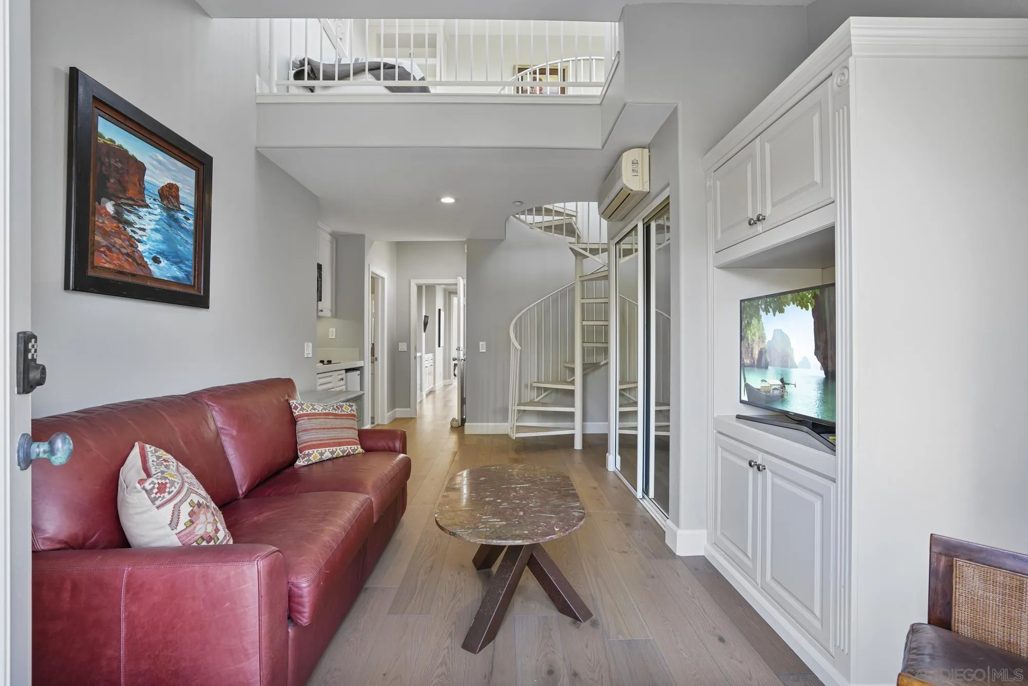 684 Cypress Hills Drive Encinitas, CA 92024 - Photo 30 of 43 a living room with furniture and a chandelier