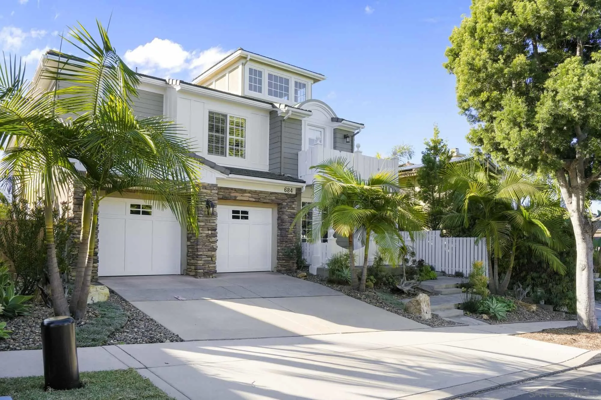 684 Cypress Hills Drive Encinitas, CA 92024 - Photo 3 of 43 a front view of a house with garden