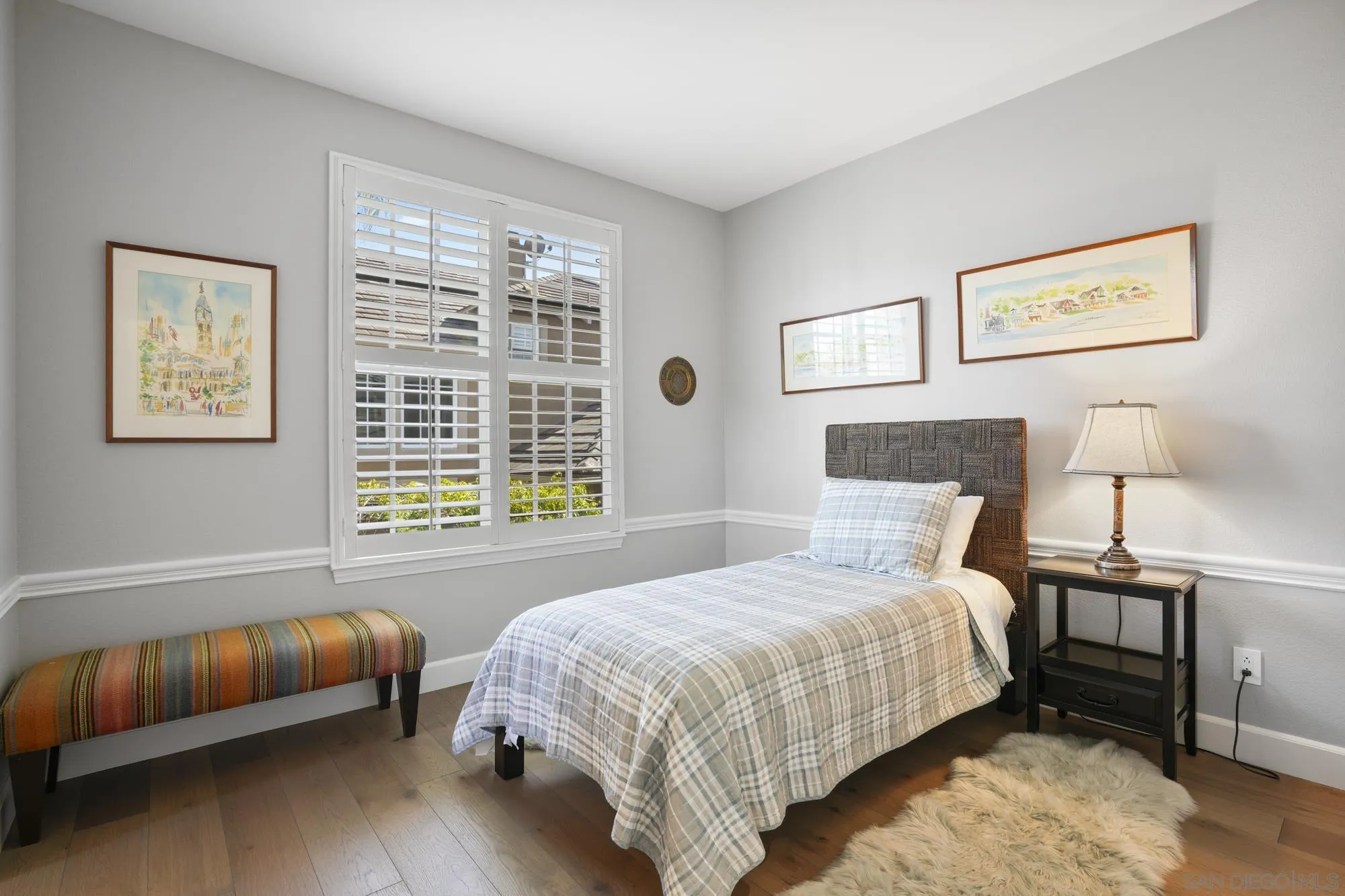 684 Cypress Hills Drive Encinitas, CA 92024 - Photo 35 of 43 a bedroom with a bed and a lamp on dresser