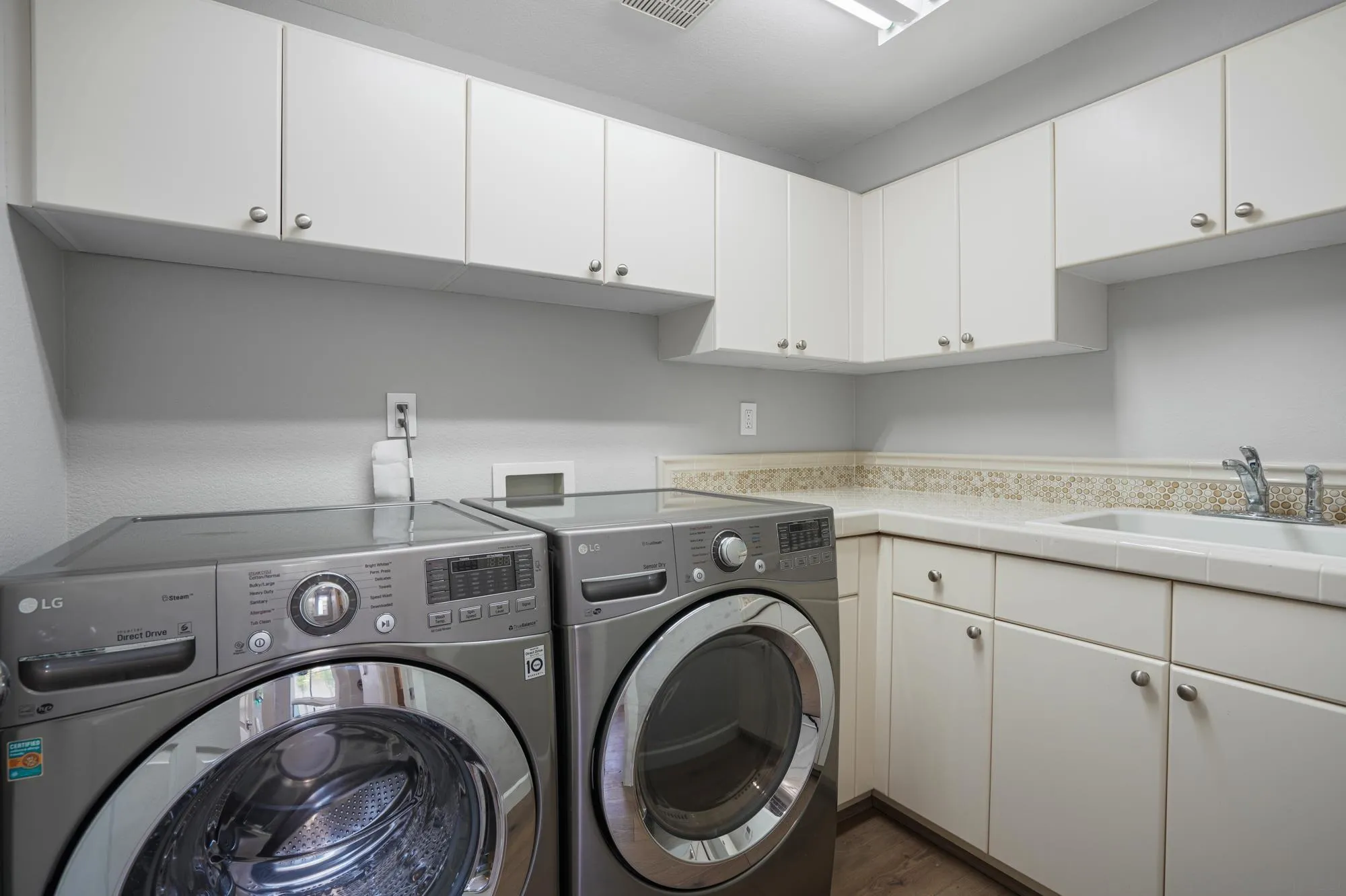 684 Cypress Hills Drive Encinitas, CA 92024 - Photo 37 of 43 a utility room with sink dryer and washer