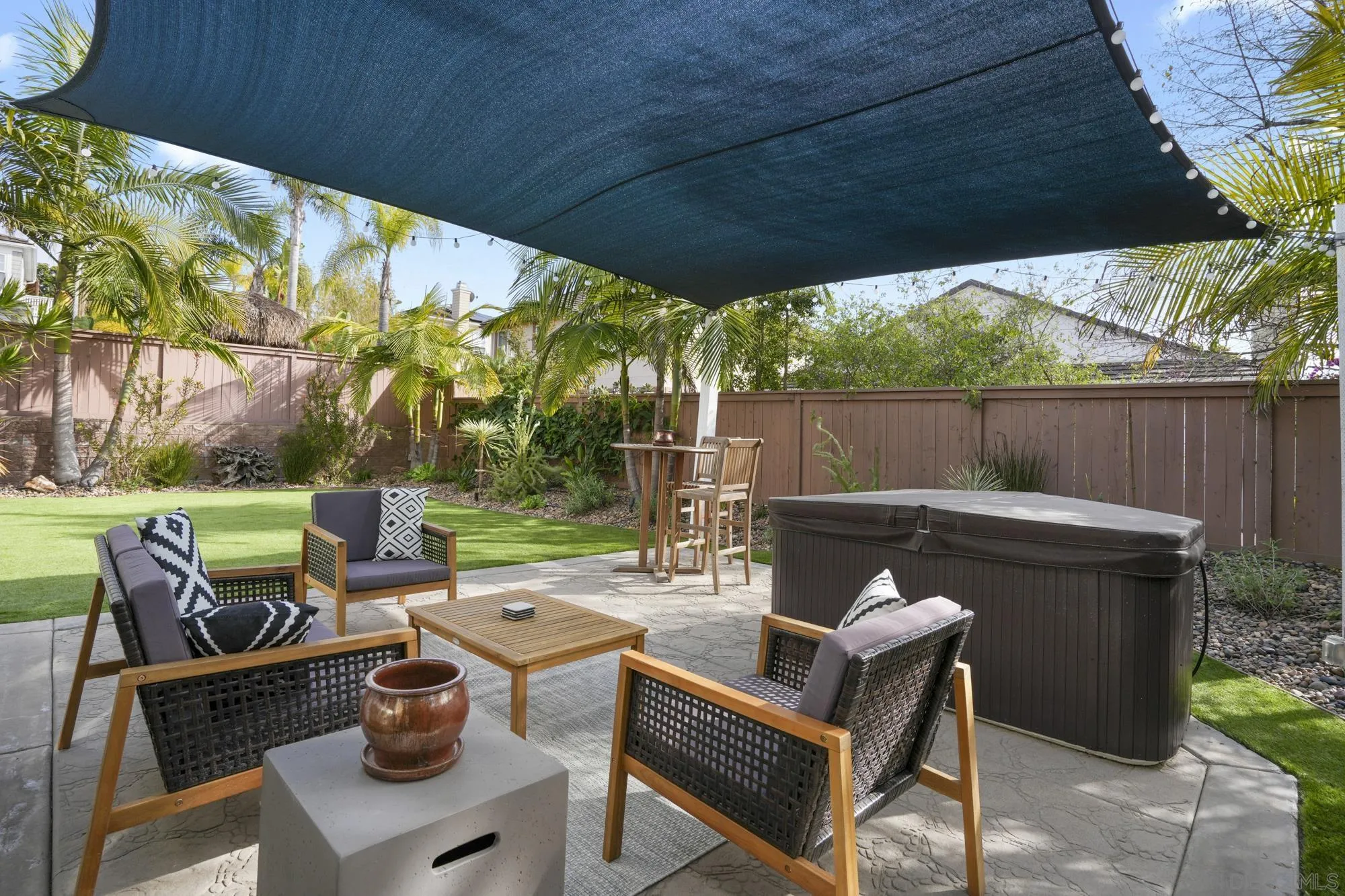 684 Cypress Hills Drive Encinitas, CA 92024 - Photo 39 of 43 a view of backyard with seating space and trees in the background