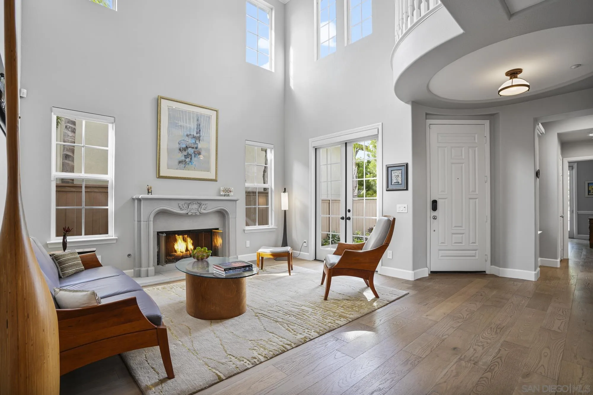 684 Cypress Hills Drive Encinitas, CA 92024 - Photo 6 of 43 a living room with furniture and a fireplace
