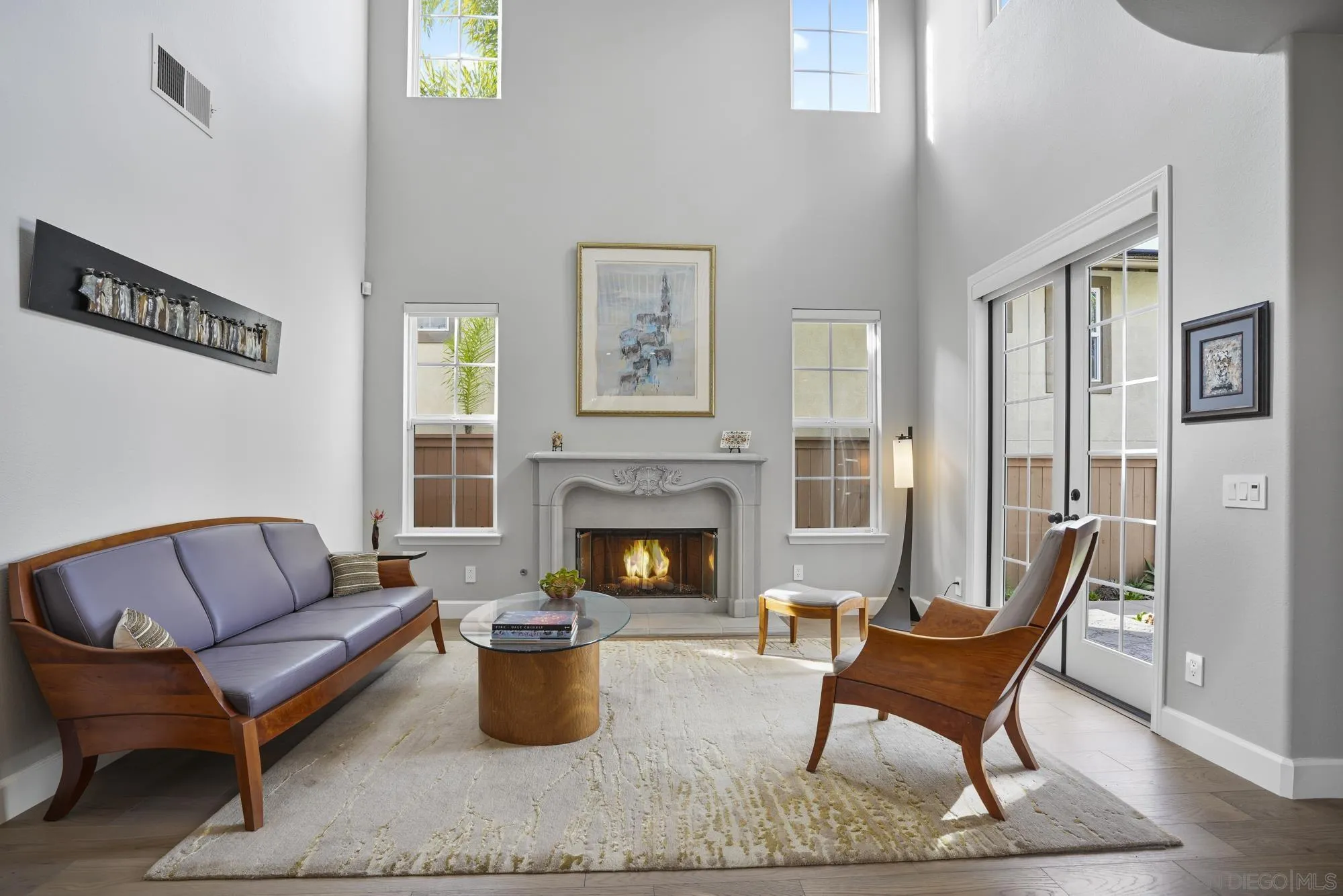 684 Cypress Hills Drive Encinitas, CA 92024 - Photo 7 of 43 a living room with furniture and a fireplace