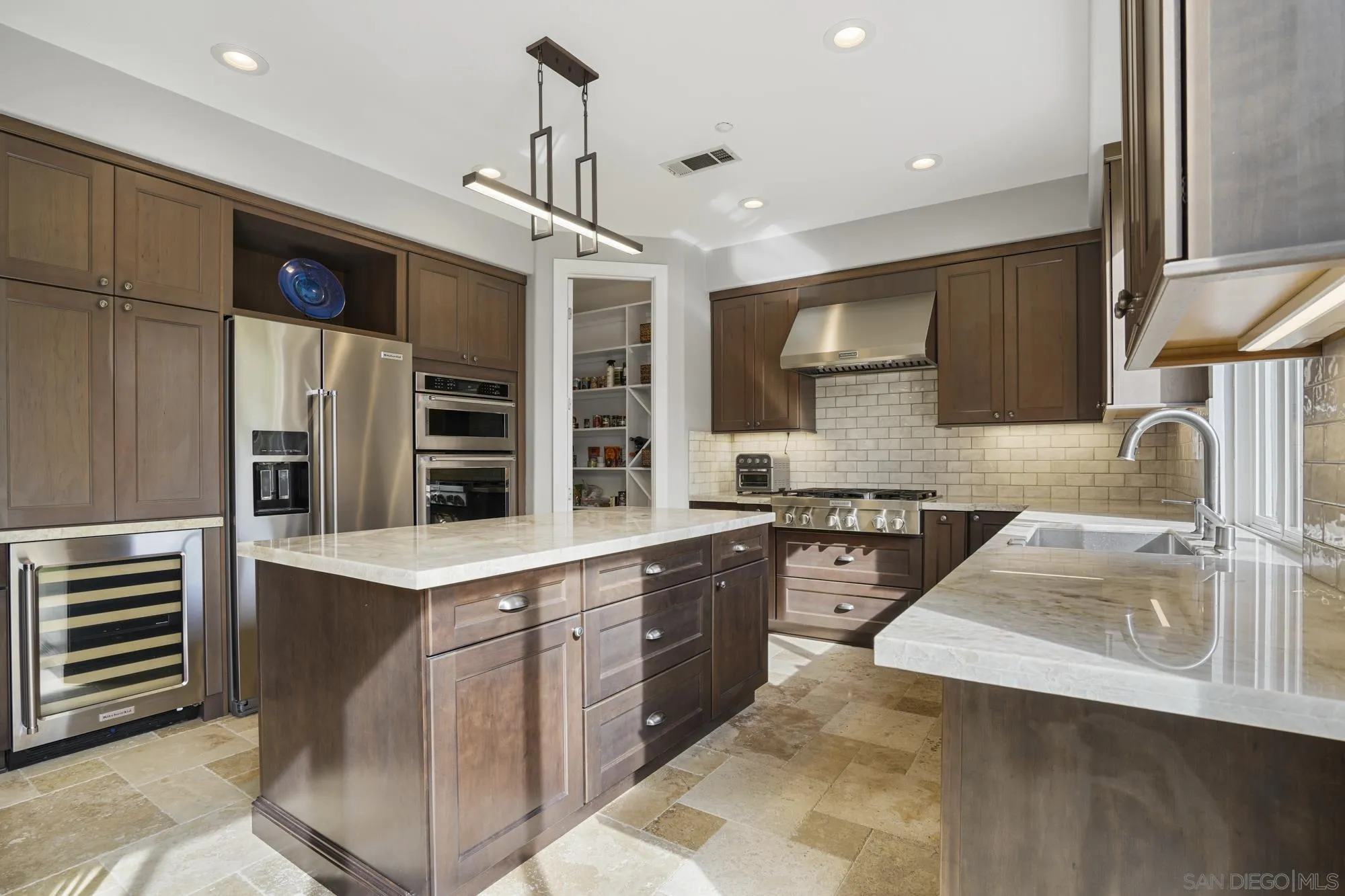 684 Cypress Hills Drive Encinitas, CA 92024 - Photo 10 of 43 a kitchen with stainless steel appliances granite countertop a sink stove and refrigerator