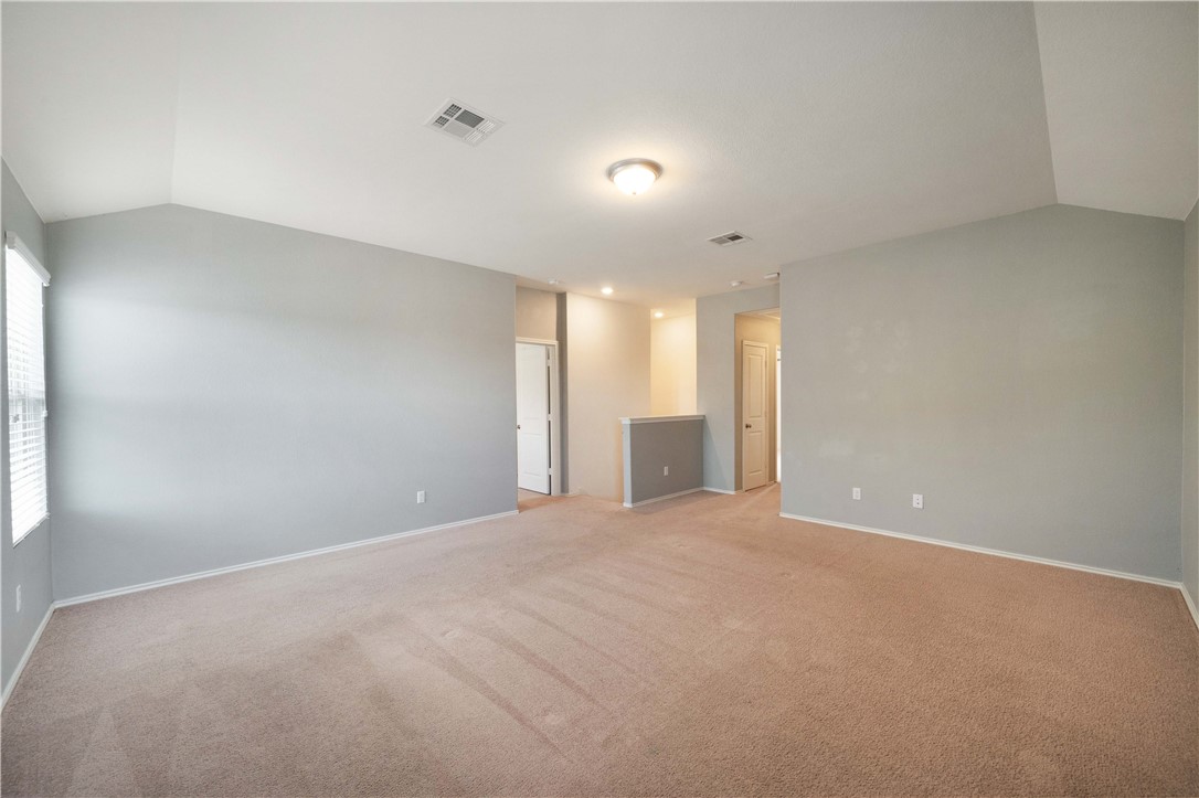 820 Kates Way Hutto, TX 78634 - Photo 21 of 30 a view of an empty room with a window